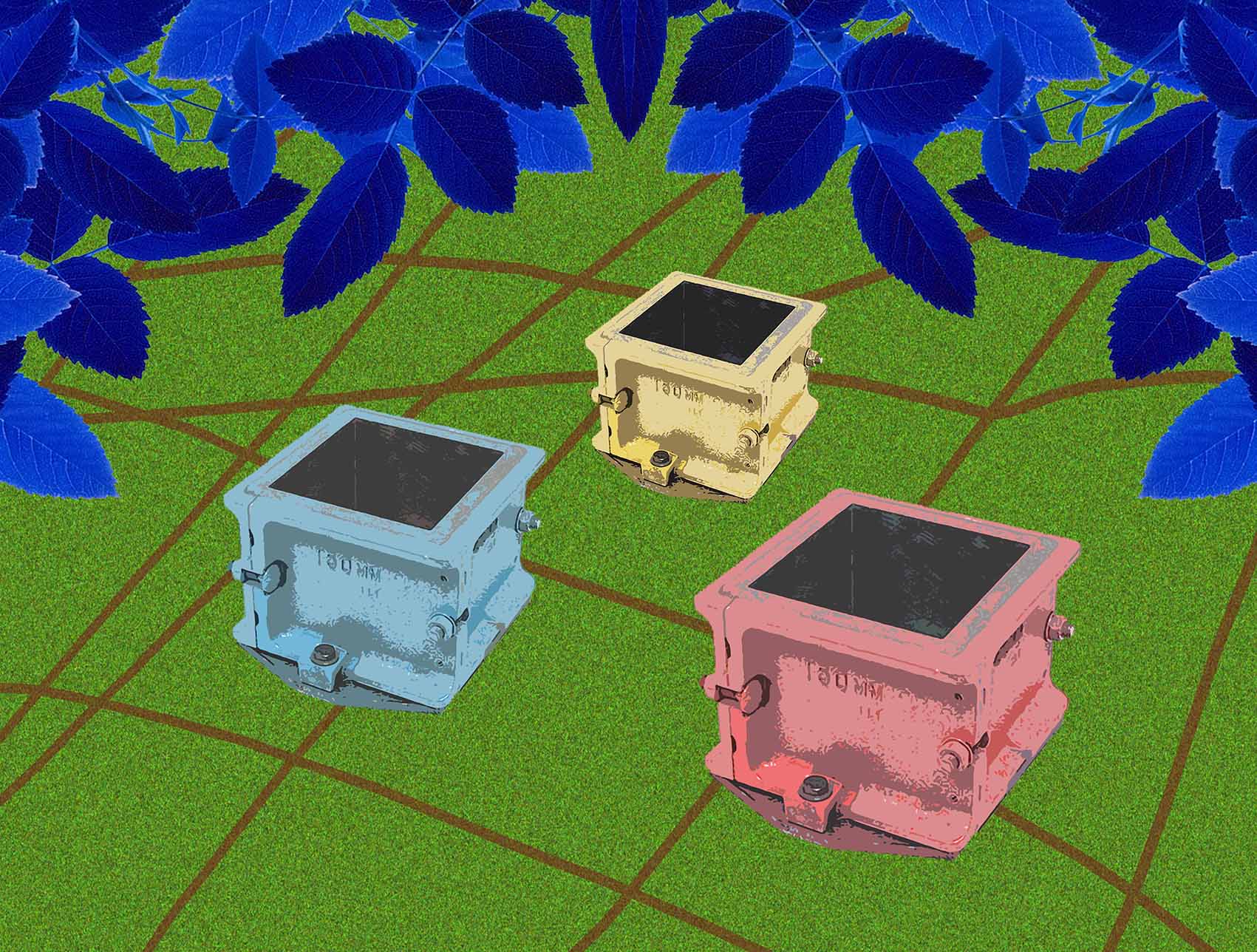 Four coloured, metal moulds (in yellow, light red and light blue), set on a green background, above which are blue leaves