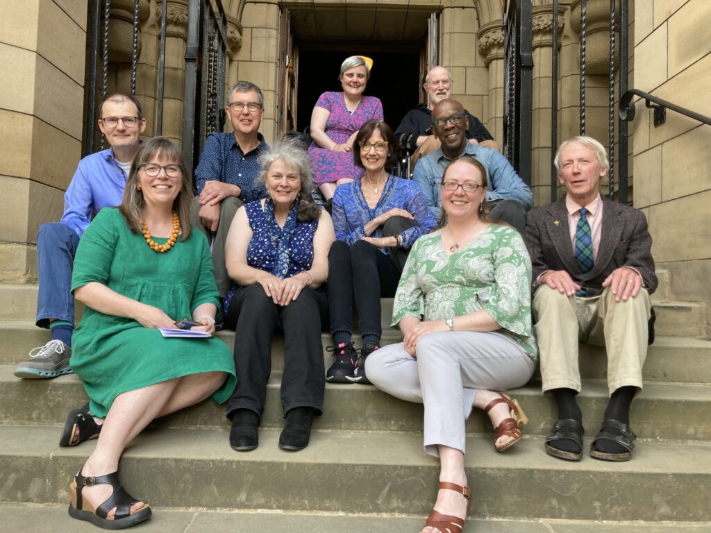 New Members sitting on steps of Glasgow University Chapel before the Hallowing Service