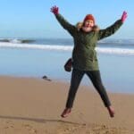 Woman jumping on the beach
