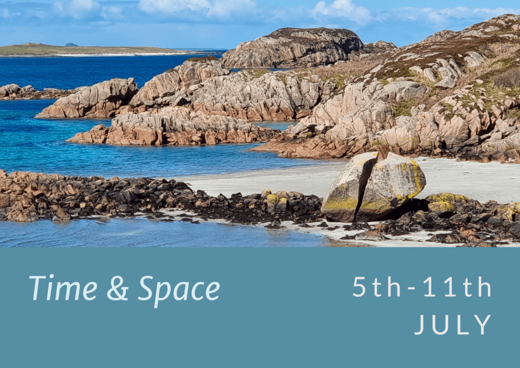 Time and Space - a broken rock on a sandy beach by torquise water