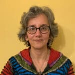 Women with a bright cardigan and yellow background