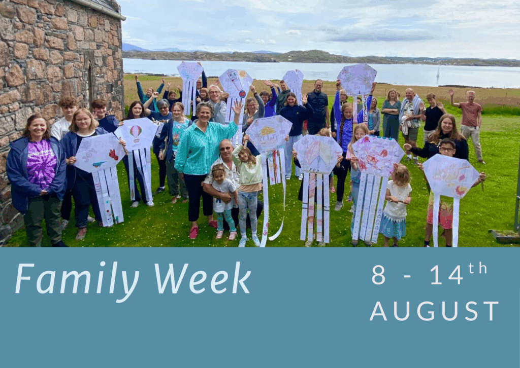 People including children with kites. Family Week.