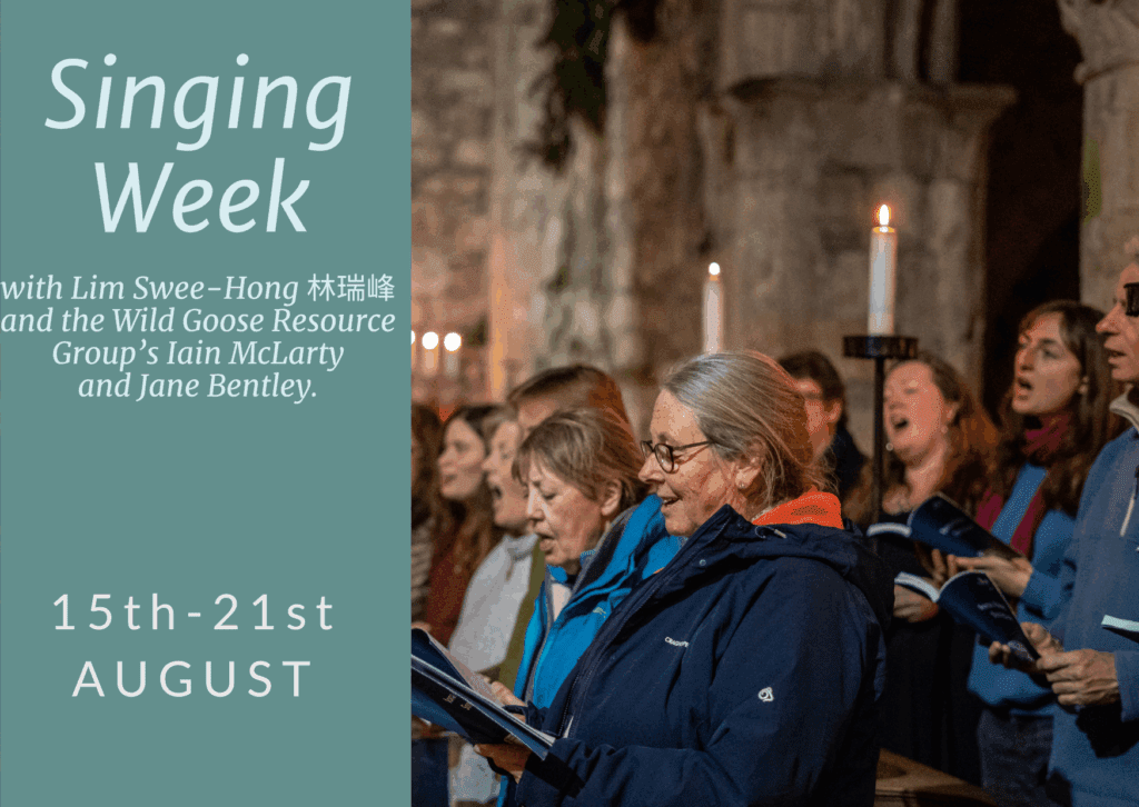 Group of people singing in Iona Abbey for Singing Week with Singing Week with Lim Swee-Hong 林瑞峰 and the Wild Goose Resource Group’s Iain McLarty and Jane Bentley.