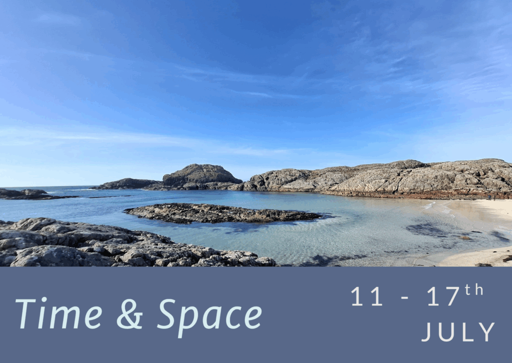 Torquise water and rocky outcrops by a sandy beach scene