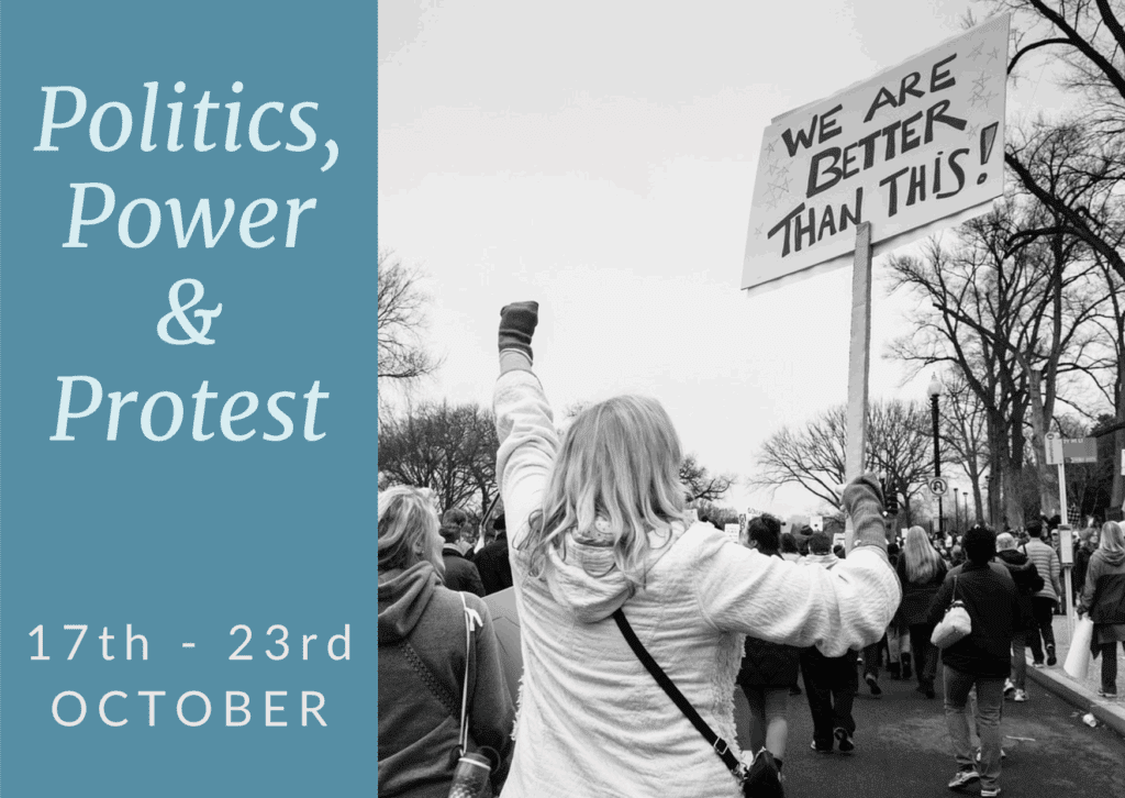 person carrying a banner that says 'we are better than this as part of the Politics, Power and Protest week