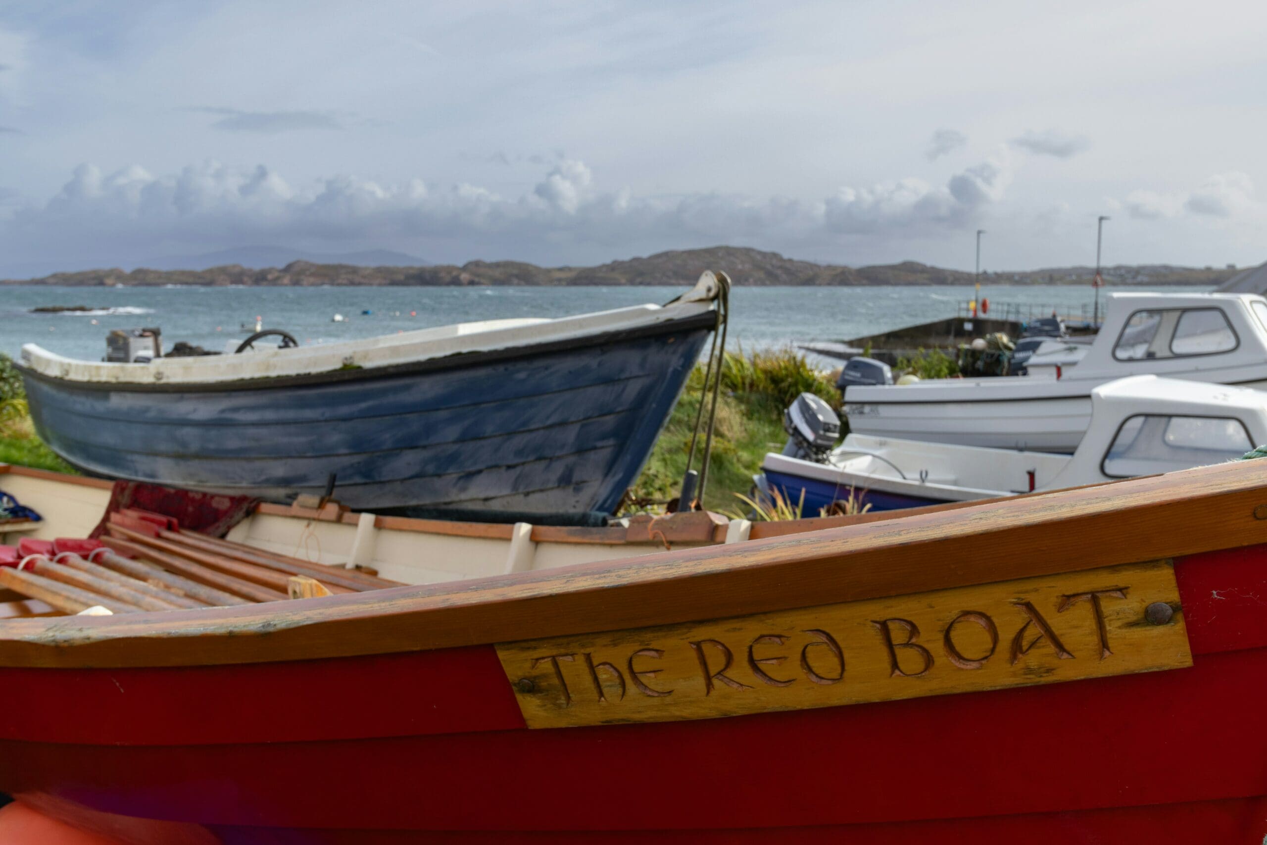 Small boats sitting by the jetty on Iona