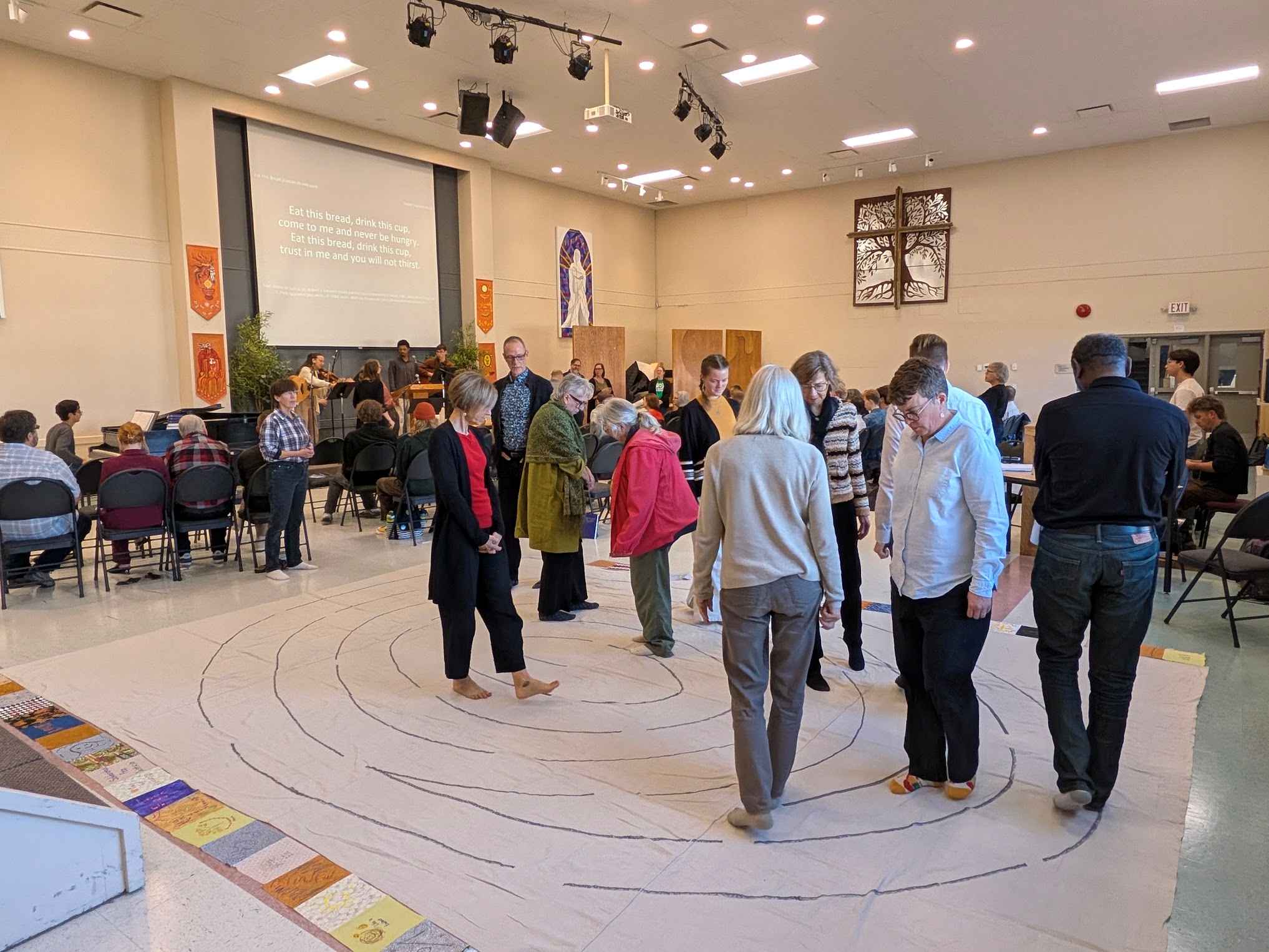 People walking a fingerprint labyrinth